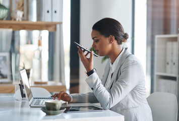 Wall Mural - Office, businesswoman and speaker with phone call for talking, communication and chat with client. Career, female person and content writer with laptop for research, job and mobile app for voice note