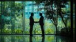 © Penatic Studio - Two Businessmen Silhouetted Against a Window with a View of Green Trees and a City Skyline