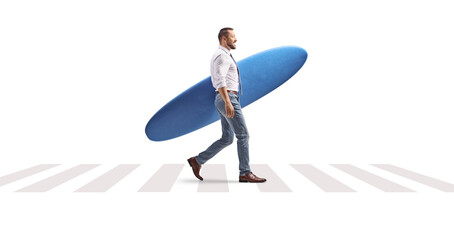 Businessman walking on a crossroad and carrying a surfboard