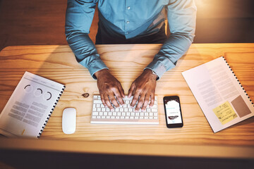 Wall Mural - Businessman, hands or typing with keyboard above at night for email, research or communication at office desk. Top view, male person or employee working late on computer for notes or project deadline