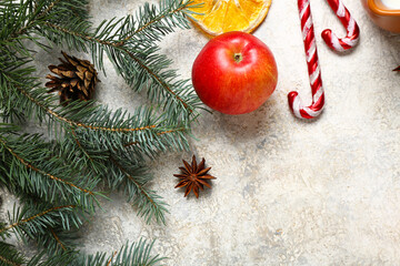 Wall Mural - Beautiful composition with apple and fir branches on grey background