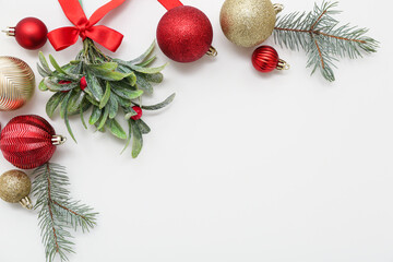 Poster - Mistletoe branch with Christmas decorations on white background