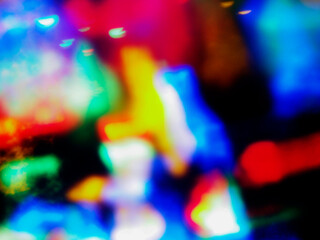 Wall Mural - a colorful, blurry background with a rainbow of colors. the colors are bright and vibrant, creating 