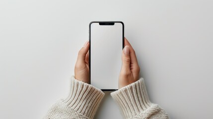 Female Hands Holding Smartphone on White Background - Top View