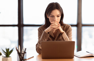Poster - Concentrated Worker. Portrait of young focused woman using laptop thinking about new project, copyspace
