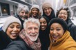 © Vorda Berge - Smiling group portrait of diverse seniors taking selfie in the city