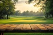 © Kind Bee Studio - Wooden table with green golf course in background at sunset.