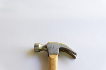 Metal hammer and wooden handle with various layouts on a white background.