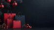 © Emilio - Elegant display of red and black shopping bags on dark background with copy space on right. Black Friday deals, holiday promotions or seasonal sales