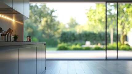 Modern kitchen with a view of a lush garden through a large window.