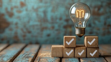 Poster - conceptual image of light bulb on wooden blocks and checkmark symbolizing creative and successful idea