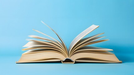 Wall Mural - A book is open on the table, with a white, blurred background and soft light. The pages of the book show colorful text in a high-definition photography style.