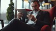 © ORG - A businessman relaxing in an airport lounge, sipping coffee while reviewing documents on his tablet, creating a moment of calm during travel