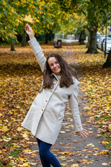 Joyful Woman in Autumn Park