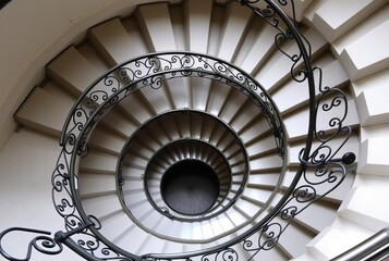 Winding Staircase A spiral staircase leading upwards with intric