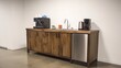 © 69 - A sleek, modern kitchenette and coffee bar in a high-tech startup office, designed for functionality and convenience with minimalist style.