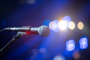 the artist's microphone stands on stage at a concert