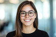 © well - Smiling woman with glasses in office setting