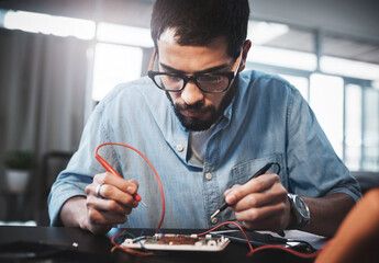 Fototapete - Remote work from home, engineering and man with solution, improvement and electrician in workspace. Employee, consultant and specialist with equipment, technician and innovation with circuit board