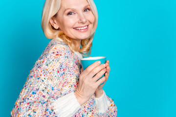 Wall Mural - Close up cropped photo of nice aged woman coffee mug wear pullover isolated on teal color background