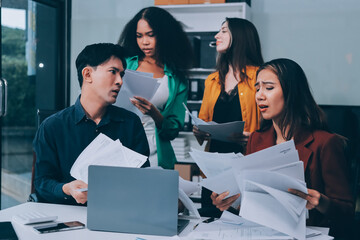 Stress, business people and employee frustrated with multitasking, pressure or overworked by team in chaos with paperwork. Anxiety, headache and worker overwhelmed by group and burnout in crisis