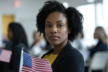 A woman holds an American flag in a room filled with people, a symbol of patriotism and unity