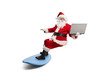 © Ljupco Smokovski - Santa claus riding a surfboard and holding a laptop computer