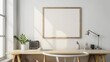 © D - A contemporary minimalist desk setup with white walls and a wooden desk. The focal point is a blank picture frame, either on the desk or on the wall. The scene includes a few essential items