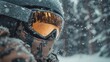 © Po - Close-up of a winter adventurer in snow-covered gear and goggles, capturing the essence of extreme weather exploration.
