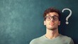 © Artyom - Young Caucasian man with glasses looking surprised next to question mark against green background