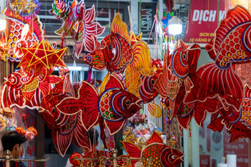 Wall Mural - Decorated colorful lanterns hanging on a stand in the streets in Hang Ma street, Ha Noi city, Vietnam during Mid Autumn Festival.