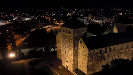 Wall Mural - Aerial view circling the entrance to the Turku castle, night in Abo, Finland