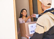 © FotoPush/peopleimages.com - Front door, delivery man and woman with package, tablet and courier with ecommerce. Apartment, employee and customer with parcel, friendly service and technology for signature, box and supply chain