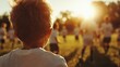 © Larisa AI - A young child watches as teammates engage passionately in a game of soccer, bathed in the warm glow of sunset, capturing innocence and camaraderie.