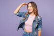 © ViDi Studio - Young smiling happy woman wear denim jacket violet top casual clothes hold hand at forehead look far away distance isolated on plain pastel light purple background studio portrait. Lifestyle concept.