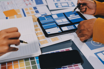 The designer team is designing the uxui system to make the uxui system work well on new phones and support system updates. Website development concept UI UX front end designer