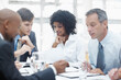 © STEEXBuyout/peopleimages.com - Business people, meeting and paperwork with team for finance, company revenue or profit at office. Group, employees or financial analysts with documents for discussion on corporate budget or expenses