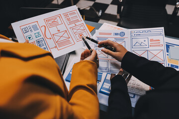 The designer team is designing the uxui system to make the uxui system work well on new phones and support system updates. Website development concept UI UX front end designer