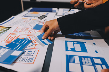 The designer team is designing the uxui system to make the uxui system work well on new phones and support system updates. Website development concept UI UX front end designer