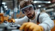 © Lens Legacy - Focused engineer in white attire with safety goggles and gloves meticulously adjusts complex machinery parts, representing dedication and precision in industrial work.