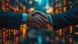© hugy - Businessmen shaking hands on a financial market charts visible in the background