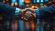 © hugy - Businessmen shaking hands on a financial market charts visible in the background