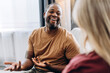 © Maria Vitkovska - Happy American man with hearing disability making gestures for woman in room