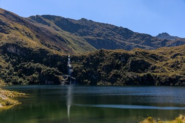 Wall Mural - Mountain landscape with waterfall and lake.