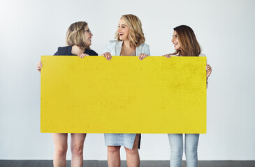 Women, happy or poster mockup in studio for job opportunity, information or business idea. People, laugh or team at board space for product placement, promotion or presentation on white background