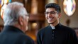 © Lion - Young Hispanic priest smiling while speaking to an elderly man after Sunday service in a Catholic church, simple composition with copy space.