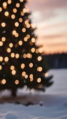 Wall Mural - vertical 9:16 christmas tree with lights at dusk in the snowy mountains