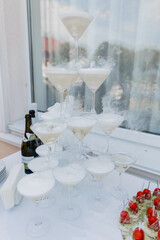 Poster - a pyramid of champagne glasses in a restaurant at a wedding