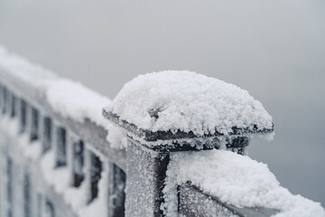 Embankment and the park are covered with snow in a severe frost