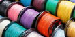 © SnowElf - Many Multicolored spools for 3D printer, assortment of plastic filaments.